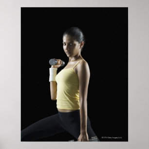 Poster Jeune femme faisant de l'exercice avec des haltère