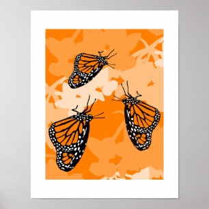 Poster Joli trio de papillons monarques sur une plante de