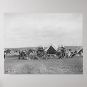 Poster Les cow-boys assis autour du chariot photo