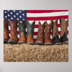Poster Ligne de bottes de cowboy sur botte de foin