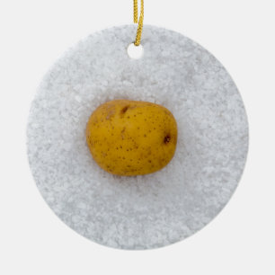 Potato macro as background with salt ceramic ornament