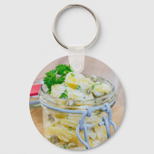 Potato salad in a jar on wooden keychain