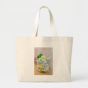 Potato salad in a jar on wooden large tote bag