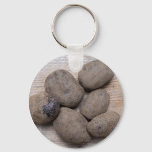 Potatoes on rustic wood Concept Keychain