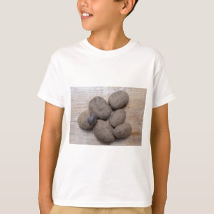 Potatoes on rustic wood Concept T-Shirt
