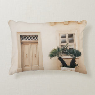 Potter plant near concrete house accent pillow