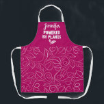 Powered by plant Vegan floral pink with name Apron<br><div class="desc">Elegant apron featuring a delicate floral white pattern on a rubin red background, with the caption Powered by plants in white lettering decorated with tiny leaves. Easily customizable by adding your name.</div>