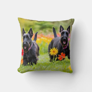 Prancing Scottish Terriers in grass and flowers Throw Pillow