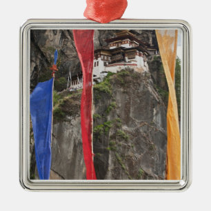Prayer flags hang near Taktshang Metal Ornament