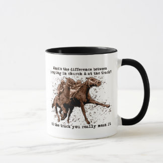 Praying at horse races mug