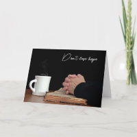 Praying Hands On Old Bible