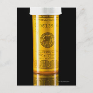 Prescription bottle with one hundred dollar bill postcard
