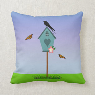 Pretty Bird Silhouette on top a Blue Birdhouse Throw Pillow