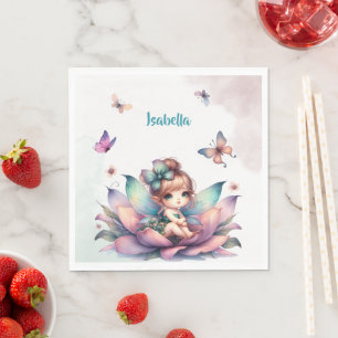Pretty fairy sitting inside flower napkin