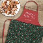 Pretty Floral Pattern Christmas Baking Crew | Name Apron<br><div class="desc">This beautiful Christmas apron features a hand drawn floral and greenery pattern in classic, traditional Christmas colours of red, green, and ivory over a dark green background. Simple, script typography reads, "Christmas Baking Crew, " and a text template is included for personalization! Stylish design that works for many different decor...</div>