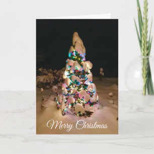 Pretty Lit up Christmas Tree Covered in Snow Card