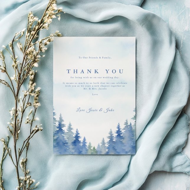 Pretty pine trees winter wedding table thank you (Blue watercolor forest wedding thank you card with elegant script and pine tree border.)