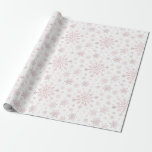 Pretty Pink Christmas Snowflakes on Winter White   Wrapping Paper<br><div class="desc">Mixed sized pretty pink snowflakes are scattered throughout this Christmas seasonal pattern. This cute festive design with a crisp winter white background is sure to please any age and perfect for anyone who likes soft and delicate xmas patterns.</div>