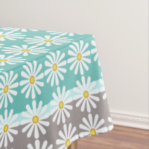 Pretty white daisies on bluegreen and grey tablecloth