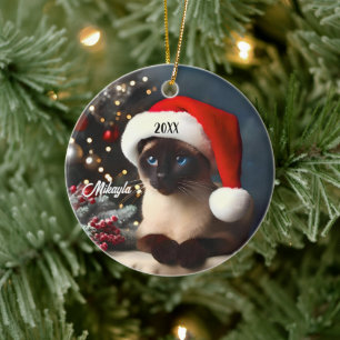 Prety Siamese Cat in a  Santa Hat Christmas Ceramic Ornament