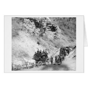 Procession of Stagecoaches Coming down Mountain