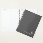 Professional Grey & White Monogram Initial Planner<br><div class="desc">Modern planner features a minimal design in a grey and white colour palette. Custom name presented in the lower right hand corner in simple stylish font with a complimentary minimal monogram medallion. Shown with a custom name and monogram initial on the front in modern typography, this personalized business planner is...</div>