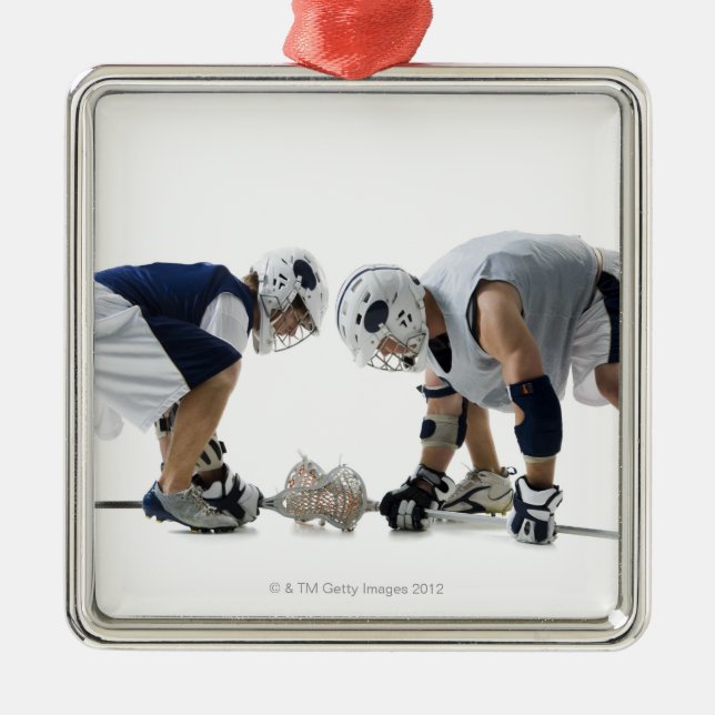 Profile of two young men playing lacrosse metal ornament (Front)