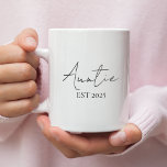 Promoted to Auntie EST 2025 | New Aunt Coffee Mug<br><div class="desc">Surprise the soon-to-be aunt in your life with this elegant “Promoted to Auntie EST 2025” coffee mug. A perfect gift to celebrate a first-time aunt’s special new role! The minimal script design adds a modern, heartfelt touch—great for pregnancy announcements, baby showers, or just because. Ideal for morning coffee, tea, or...</div>