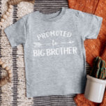 Promoted to Big Brother Pregnancy Announcement Baby T-Shirt<br><div class="desc">Custom printed apparel personalized with "Promoted to Big Brother" graphic in trendy modern fonts with a boho arrow design. Perfect for a pregnancy announcement photo or a gift for older siblings when new baby arrives! Use the design tools to edit the colours or add your own text and photos to...</div>