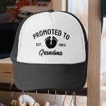 Promoted To Grandma Baby Footprints Trucker Hat<br><div class="desc">Promoted to grandma est. 20XX in black typography with black coloured baby footprints graphic.  Perfect as a gift for current or soon to be grandmas for Mother’s Day,  birthday or as a baby reveal gift to wear for family photos with the newborn.</div>