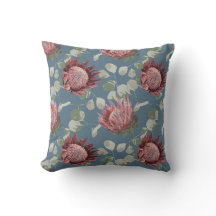 Prothé vert et rose sur coussin d'accents bleu gri