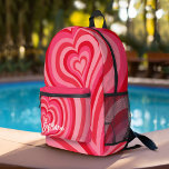 Psychedelic Hearts Calligraphy Script Name Pinks Printed Backpack<br><div class="desc">A funky heart pattern with pastel pinks and reds. The modern script adds a funky, modern touch to this retro design. Add your name or delete the text for a fun feminine backpack. The name is a trendy script in a large white size. If you click on the customize link,...</div>