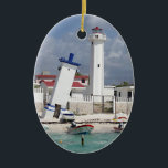 Puerto Morelos Lighthouse Ceramic Ornament<br><div class="desc">Oval ceramic ornament with an image of a lighthouse and leaning tower in Puerto Morelos,  Quintana Roo,  Mexico. Red back. See the entire Mexico Ornament collection in the HOME section.</div>