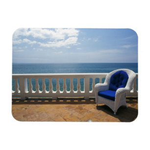 Puerto Rico. Wicker chair and tiled terrace at Magnet