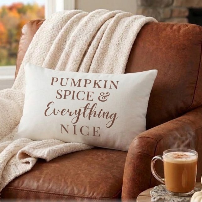 Pumpkin Spice & Everything Nice Fall Lumbar Pillow (Terracotta "Pumpkin Spice & Everything Nice" lumbar pillow on a leather armchair)
