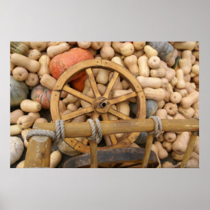 Pumpkins and Wheel of the rural wooden cart Poster