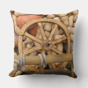 Pumpkins and Wheel of the rural wooden cart Throw Pillow
