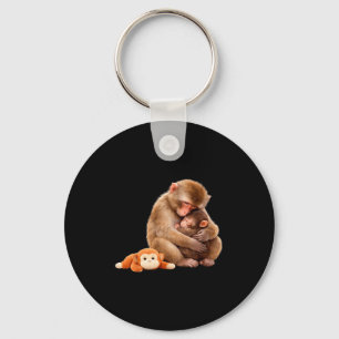 Punch the monkey cuddling stuffed animal meme keychain