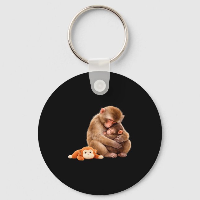 Punch the monkey cuddling stuffed animal meme keychain (Front)