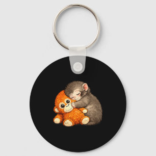 Punch the monkey cuddling stuffed animal meme keychain