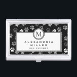 Puppy Dog Paws | Black & White | Grey Monogram Business Card Holder<br><div class="desc">Animal themed business card holder features a stylish and whimsical puppy dog paw print pattern with charcoal grey, light grey and white paw prints on a black background with custom name and title or role presented on a white banner with coordinating grey and black accents and text. Monogram initial presented...</div>