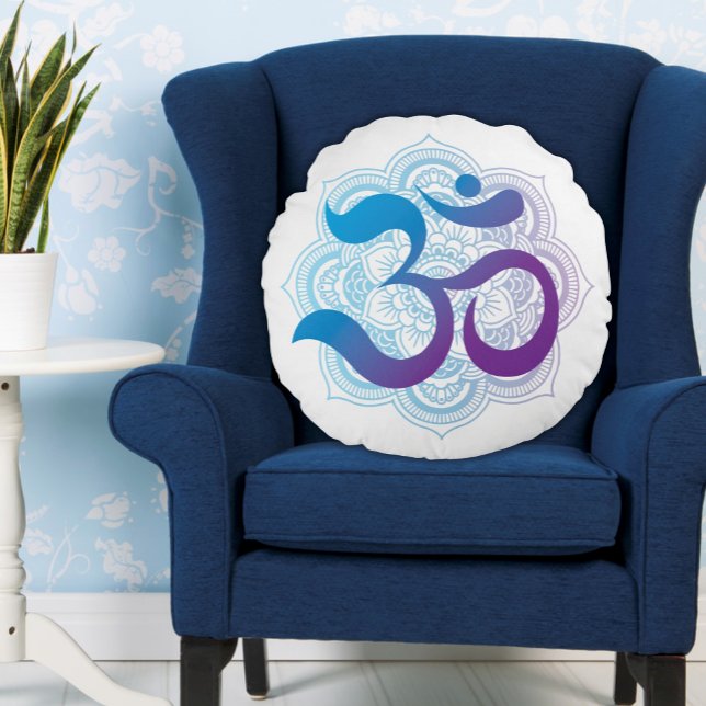 Purple and Blue Om Symbol Mandala Flower White Round Pillow (White Round Pillow with Blue and Purple Om Symbol and an Indian Lotus Flower Icon on a Blue Chair)