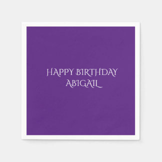 Purple birthday napkins with personalized name.