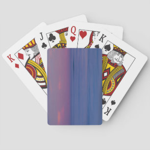Purple-coloured sunrise on ocean shore playing cards