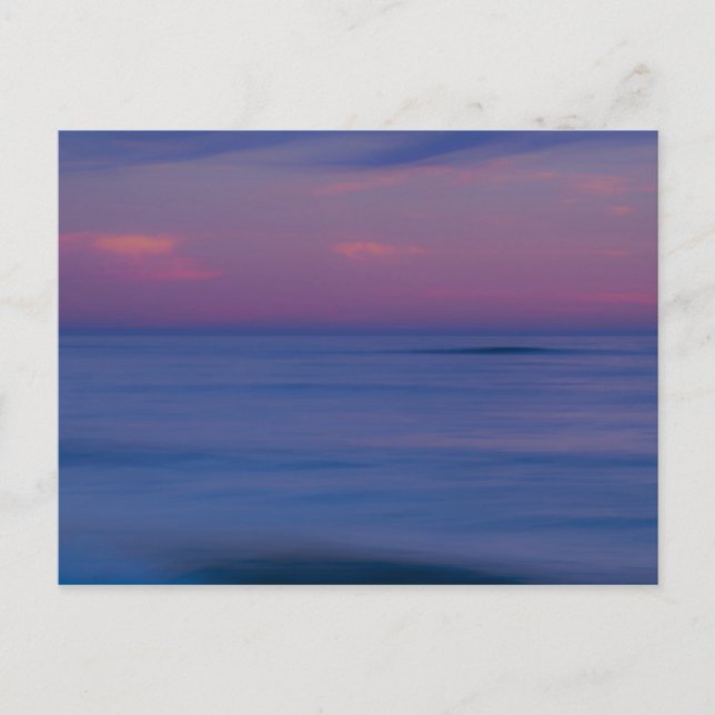 Purple-coloured sunrise on ocean shore postcard (Front)
