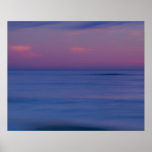 Purple-coloured sunrise on ocean shore poster