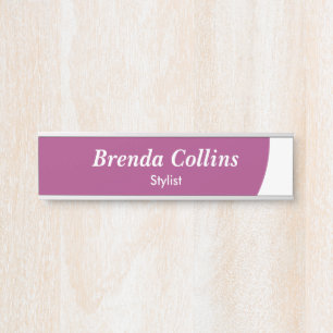 Purple curve and white door sign