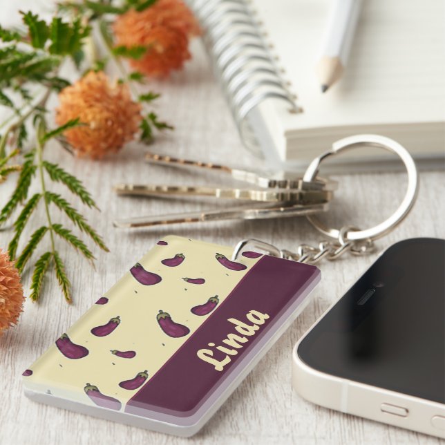 Purple eggplants on yellow keychain (Front Right)