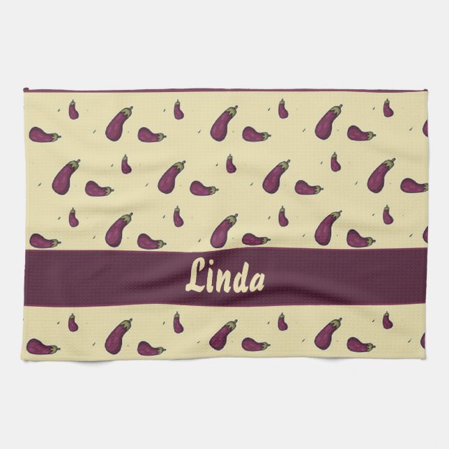 Purple eggplants on yellow kitchen towel (Horizontal)