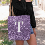 Purple Faux Glitter Bokeh Sparkles Monogrammed Tote Bag<br><div class="desc">A modern bold single letter monogram in white with a black drop shadow. The font size, colour and style are customizable. The background is a faux purple glitter with sparkly spots or bokeh. Move or delete the tiny faux sparkle graphics. A nice gift for a bridesmaid or other member of...</div>